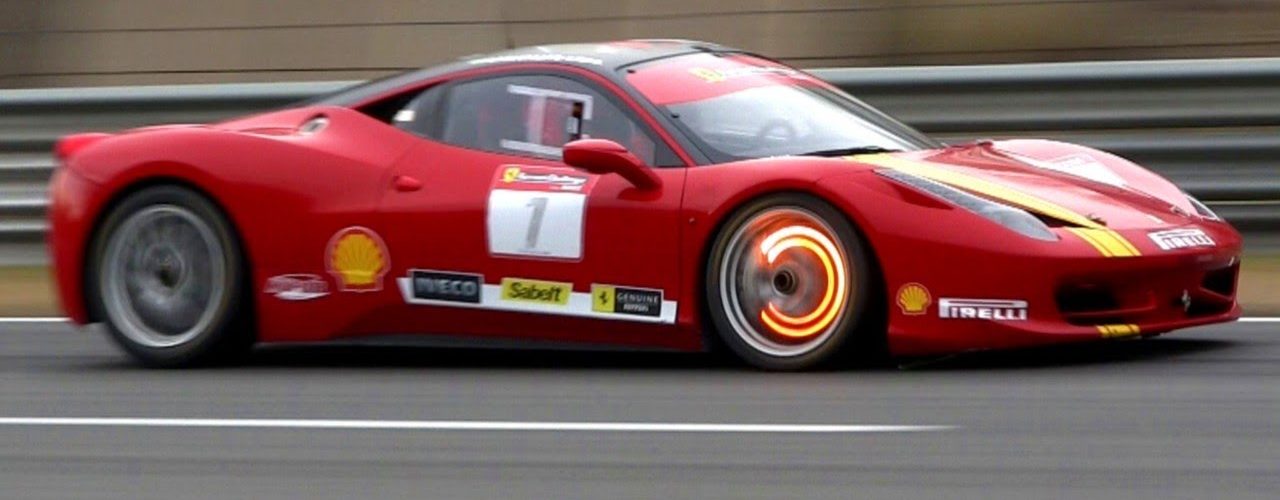 glowing Ferrari brake pads on the track
